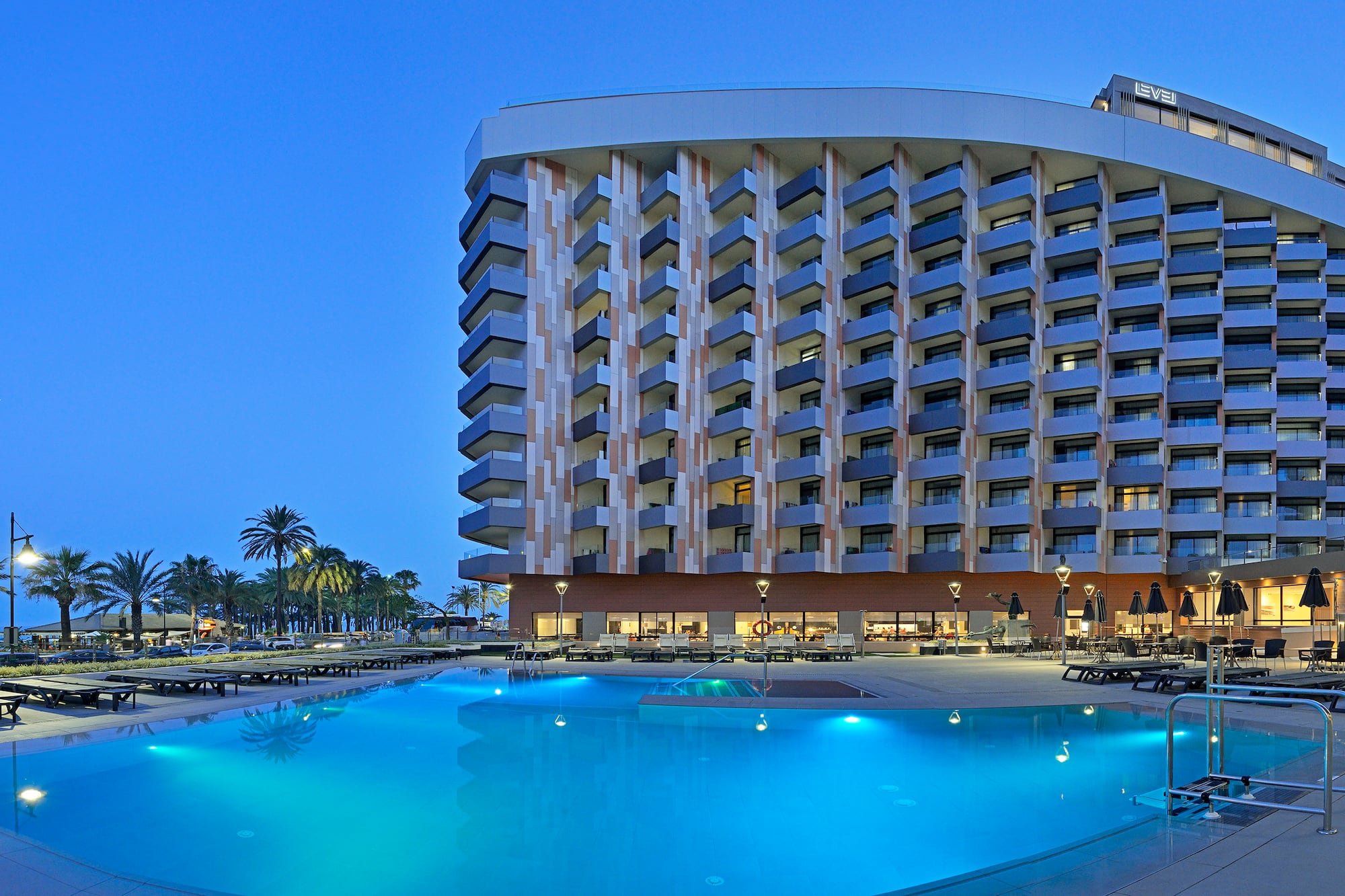 a pool and a building with a large building