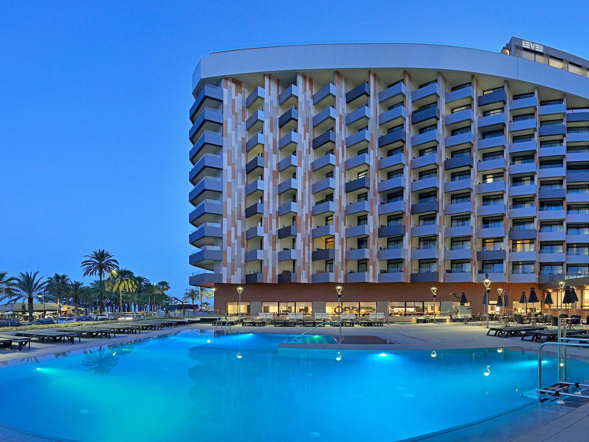 a pool and a building with a large building