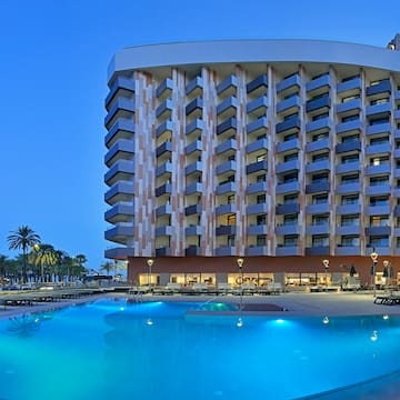 a pool and a building with a large building