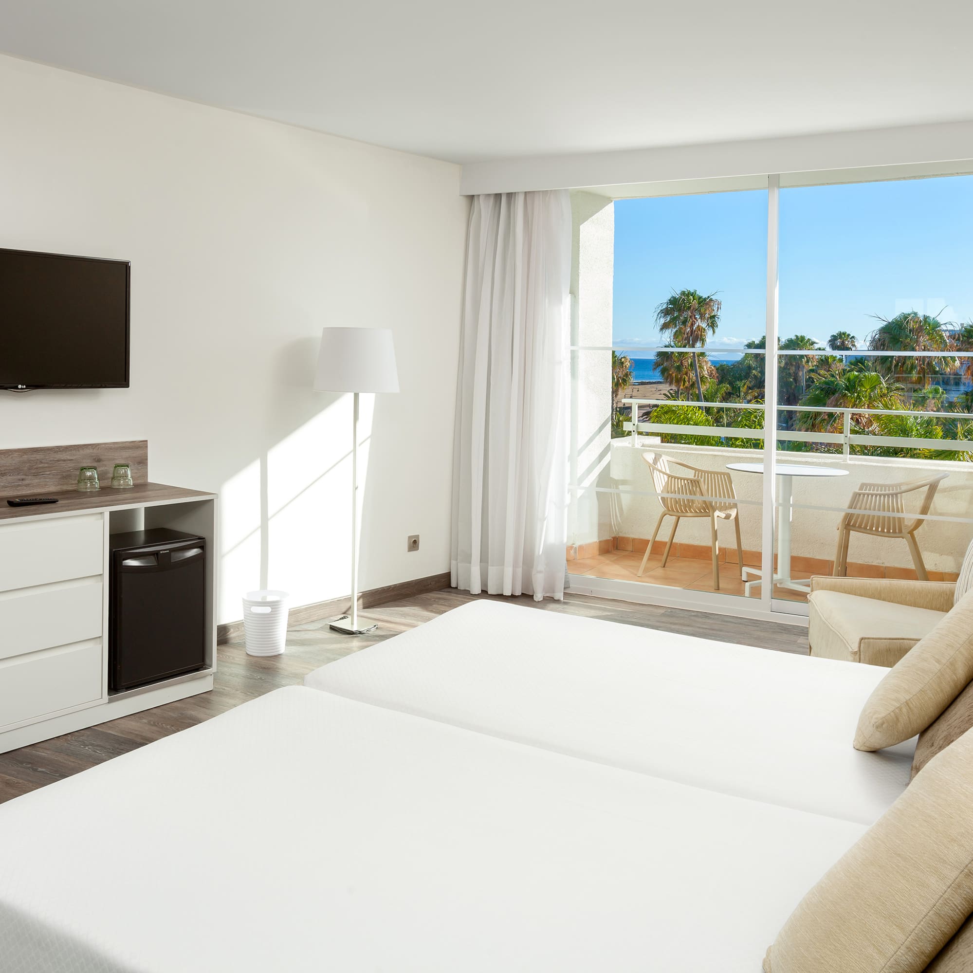 a room with a television and a bed