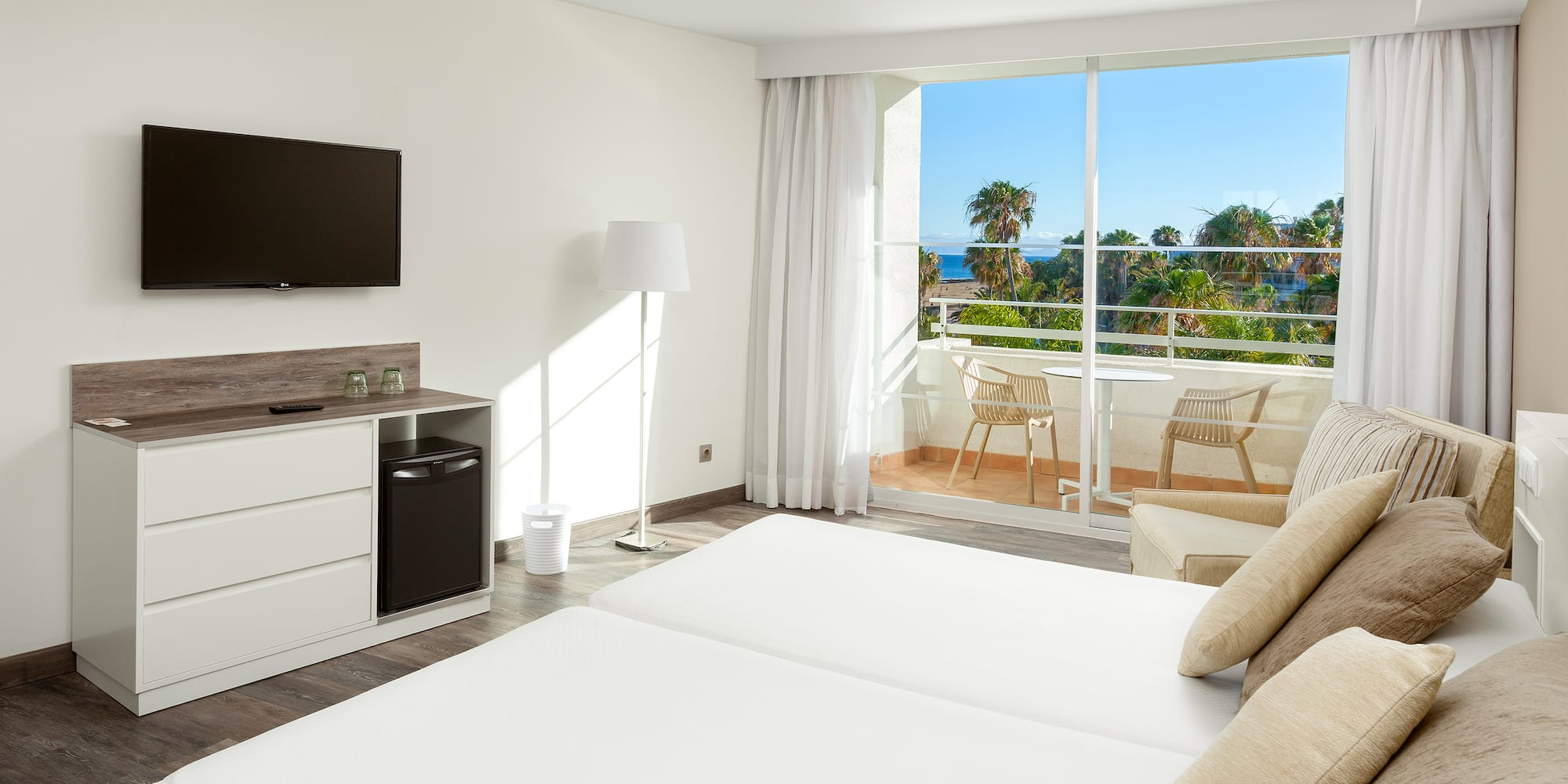 a room with a television and a bed