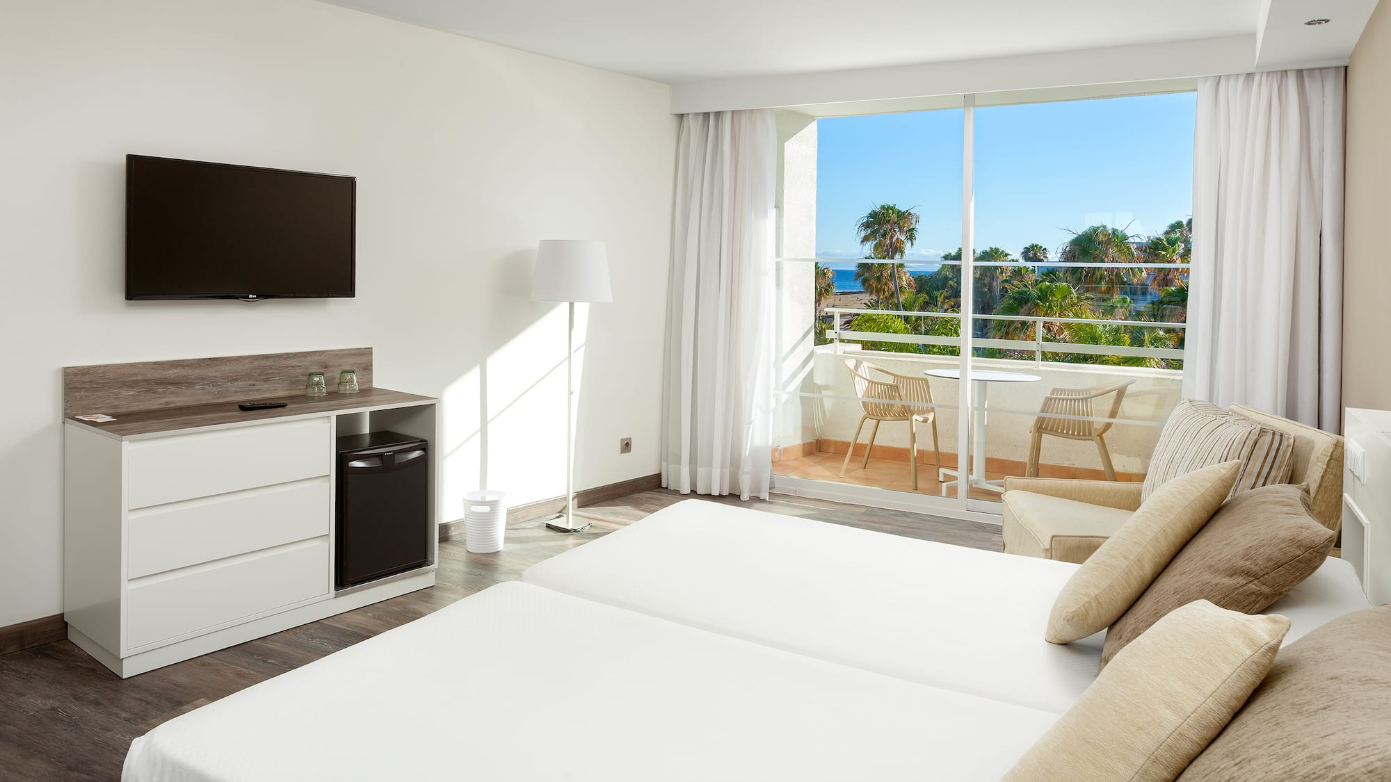 a room with a television and a bed