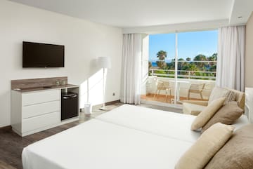 a room with a television and a bed