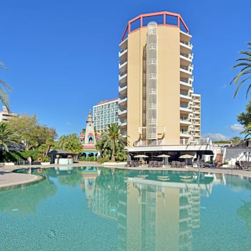 a pool with a building in the background