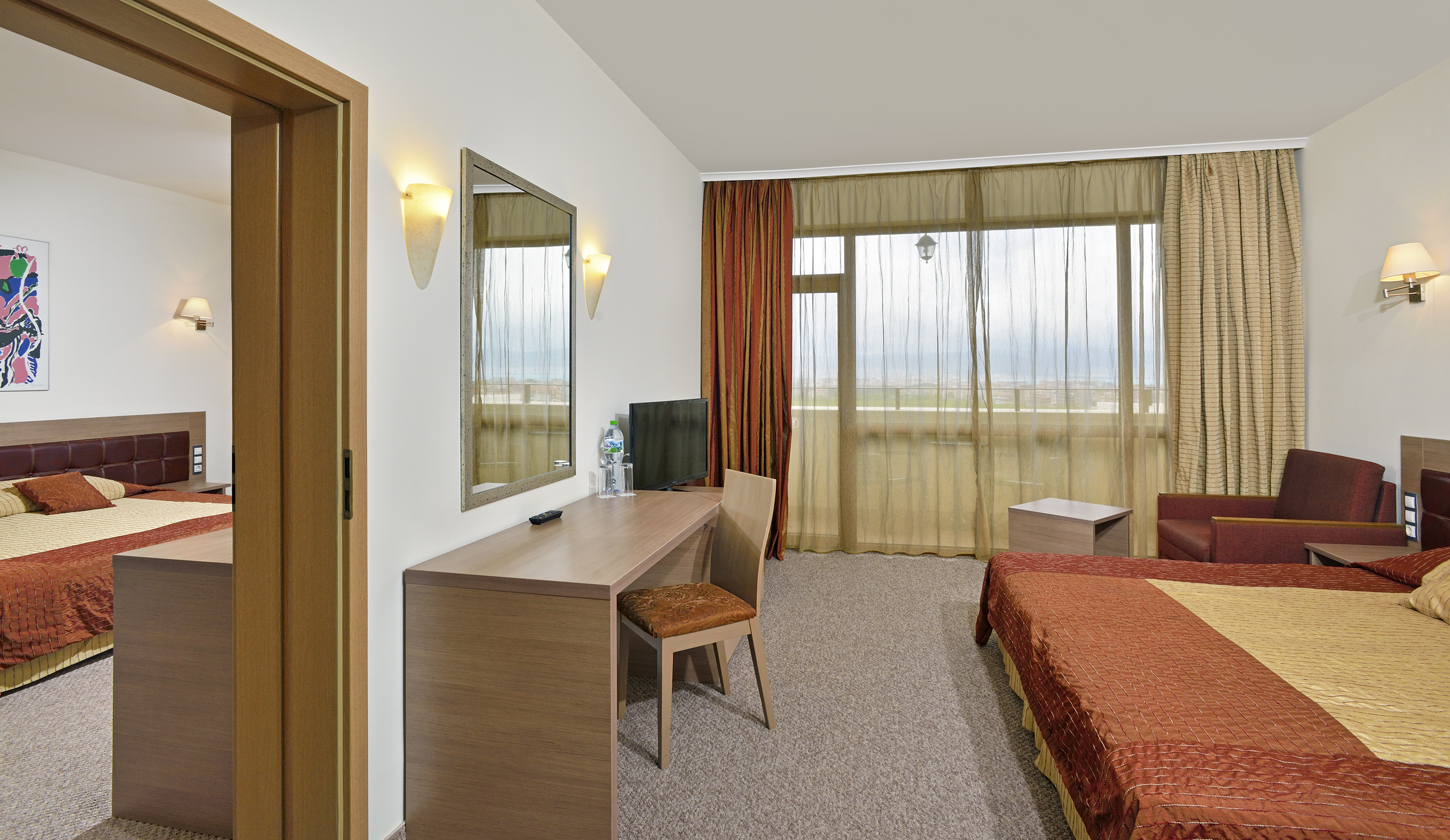 a room with a bed and a mirror