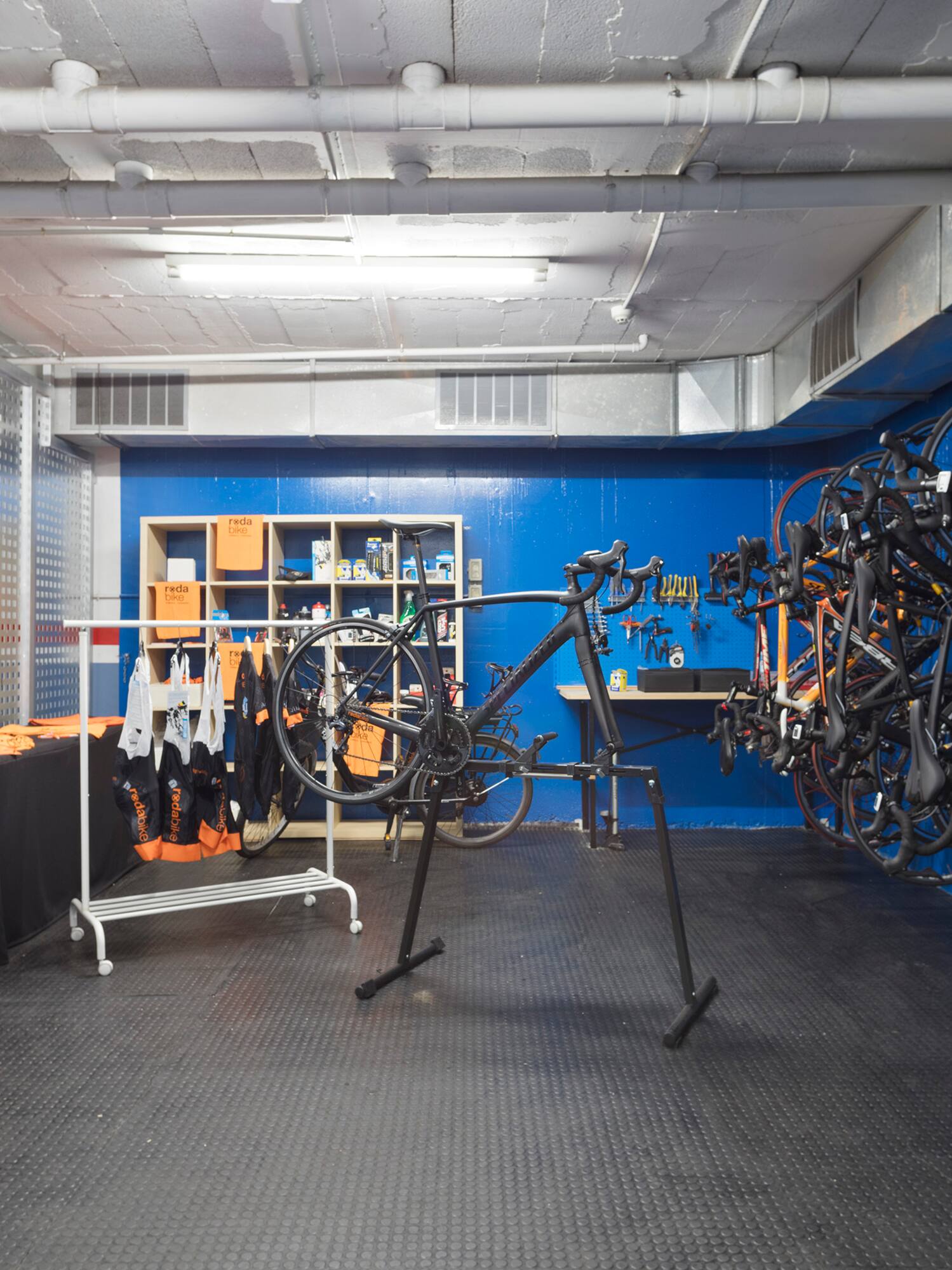 a room with a rack of bicycles