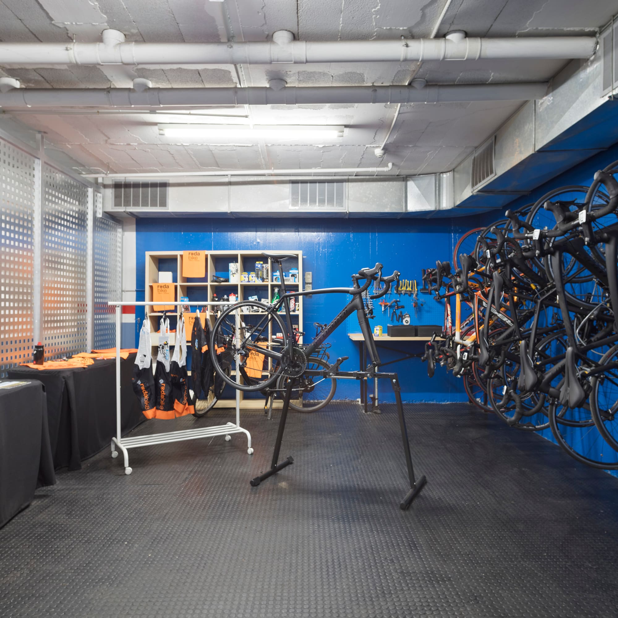 a room with a rack of bicycles