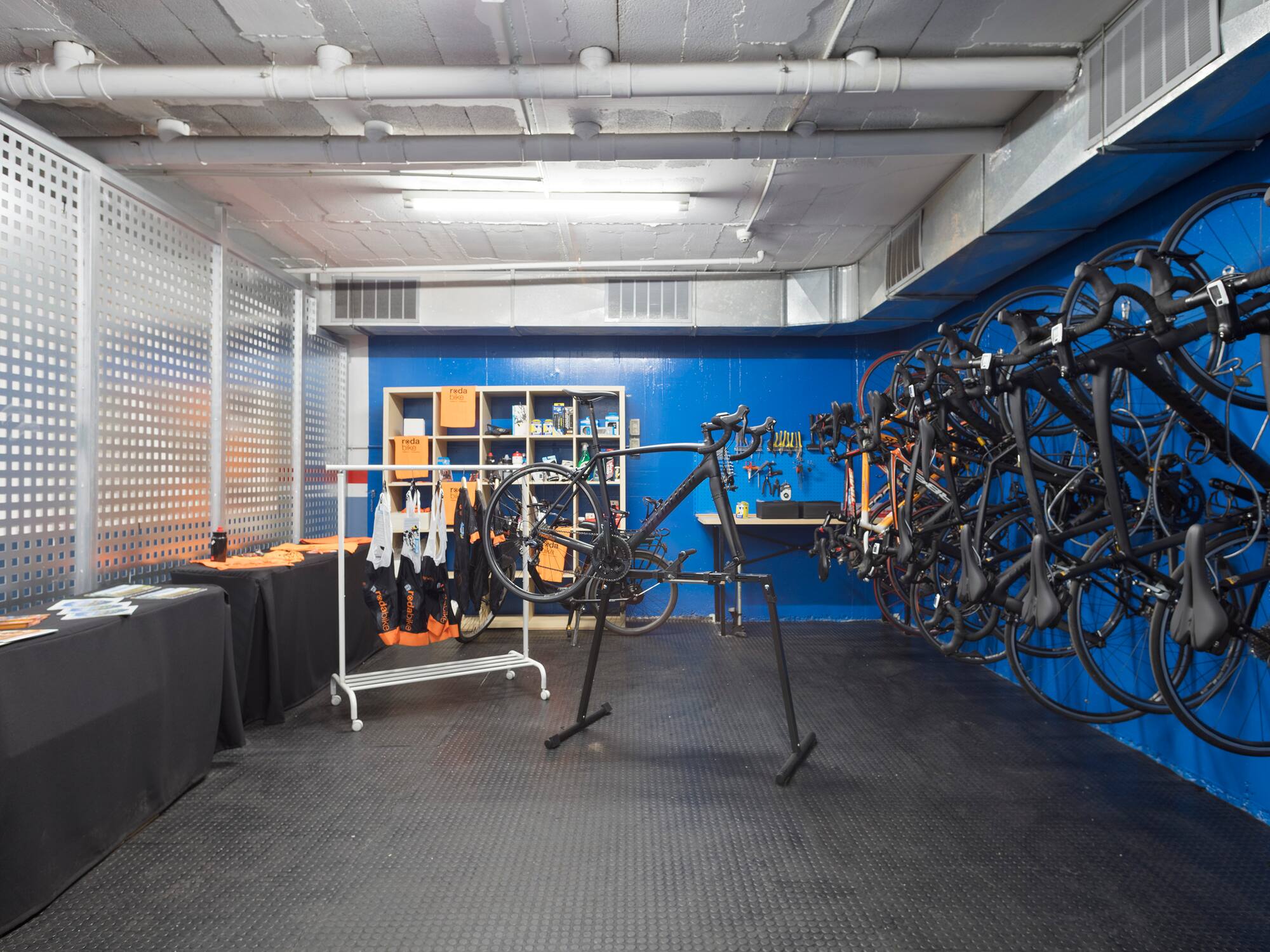 a room with a rack of bicycles