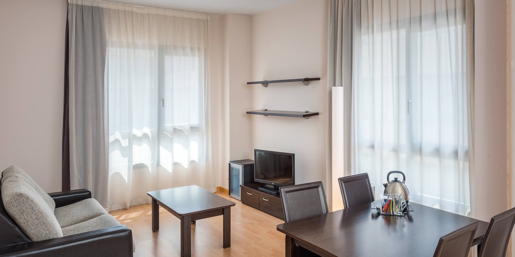 a living room with a couch and table