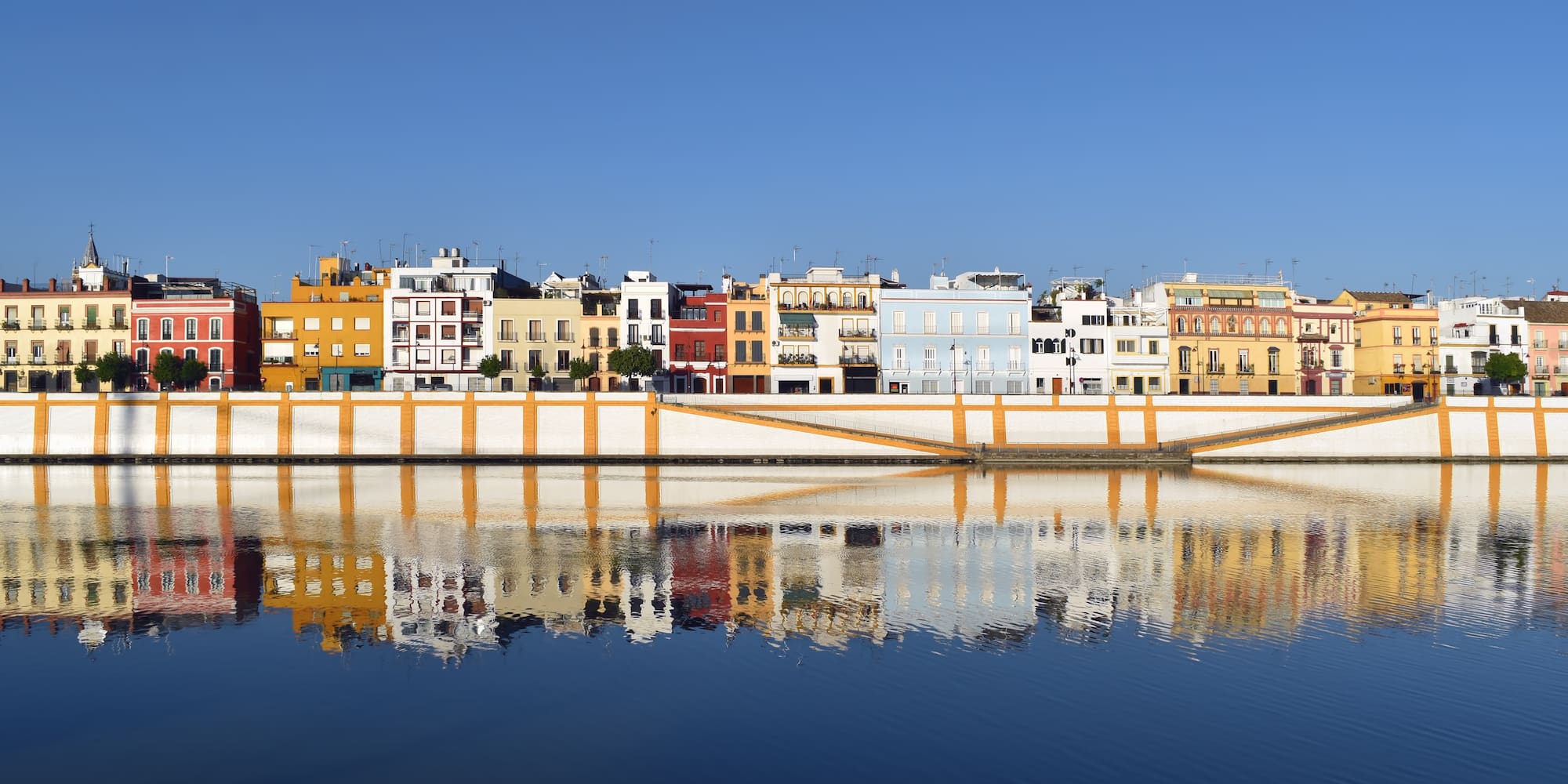 a row of colorful buildings on a body of water