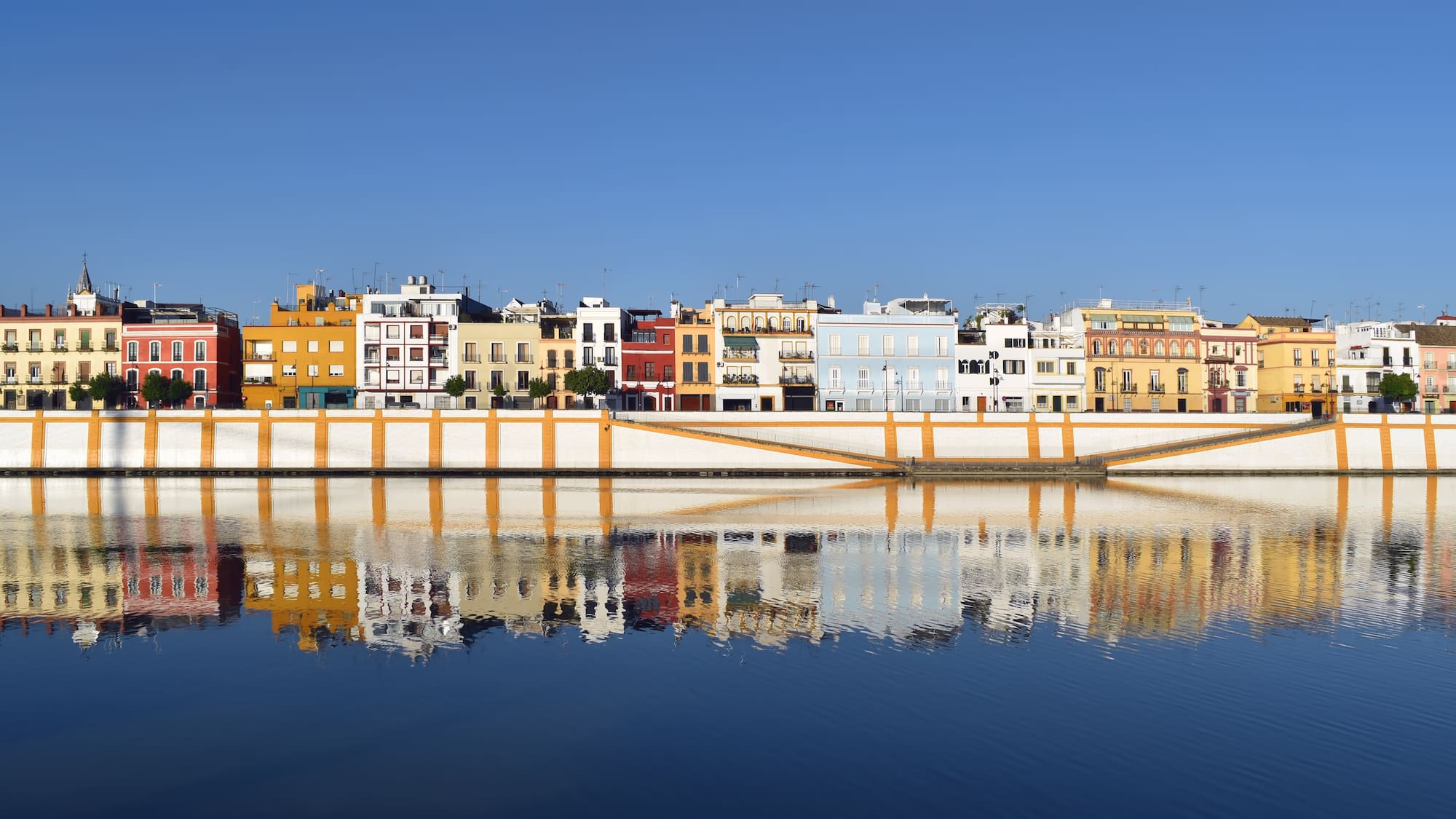 a row of colorful buildings on a body of water