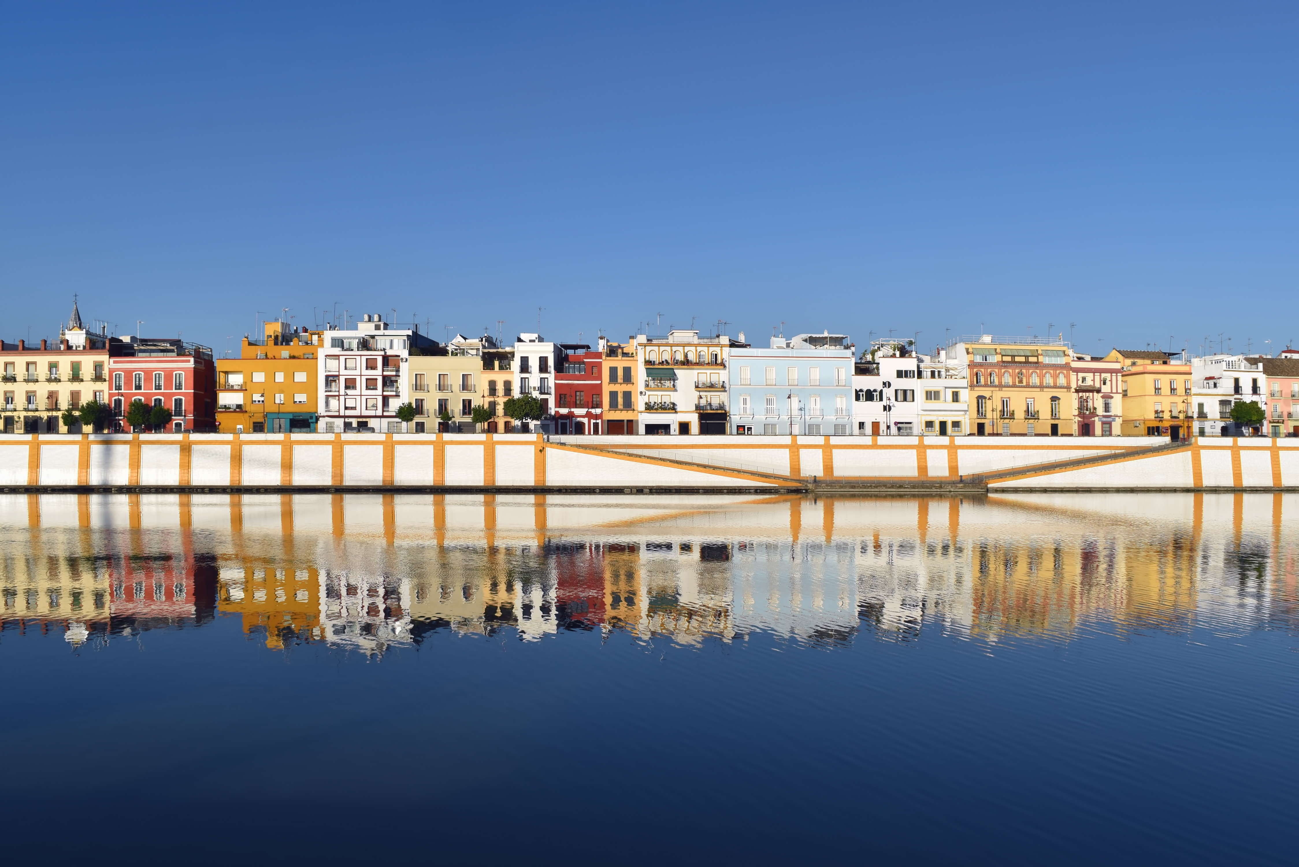 a row of colorful buildings on a body of water