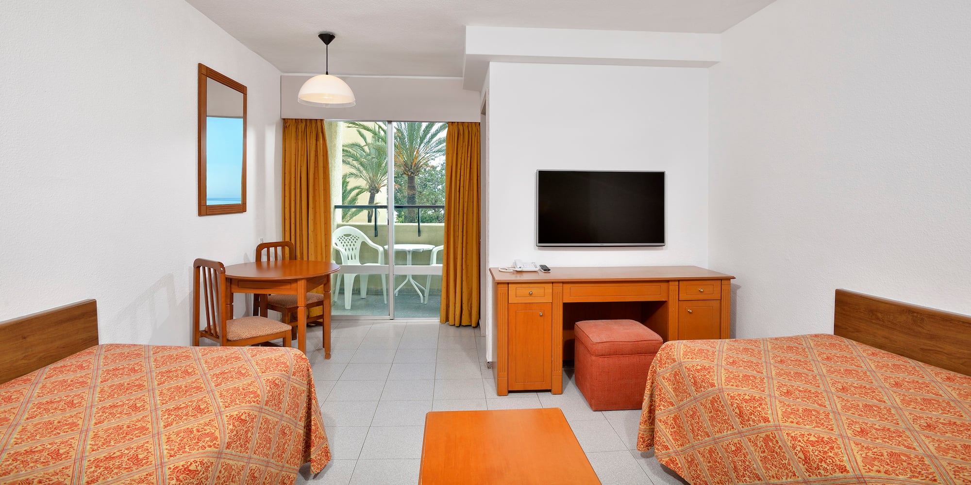 a room with a television and table