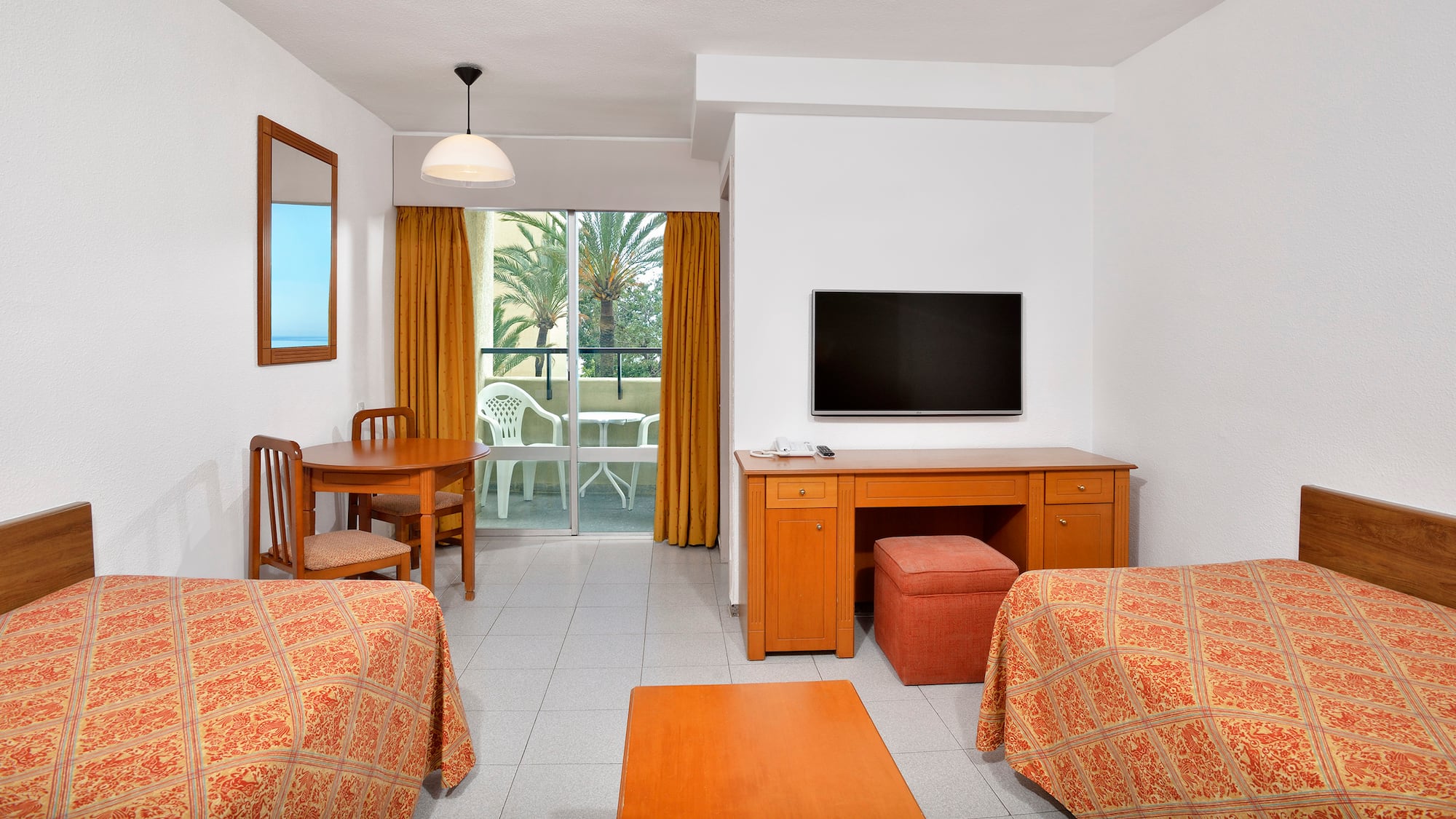 a room with a television and table