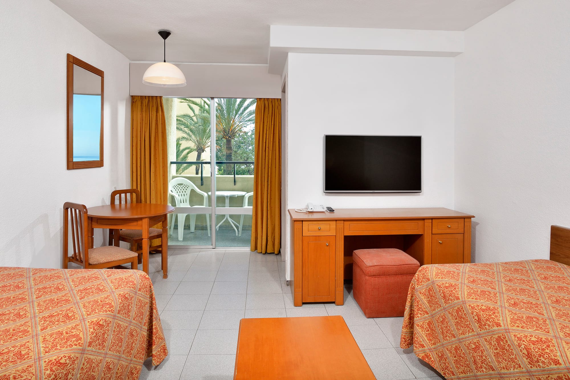 a room with a television and table