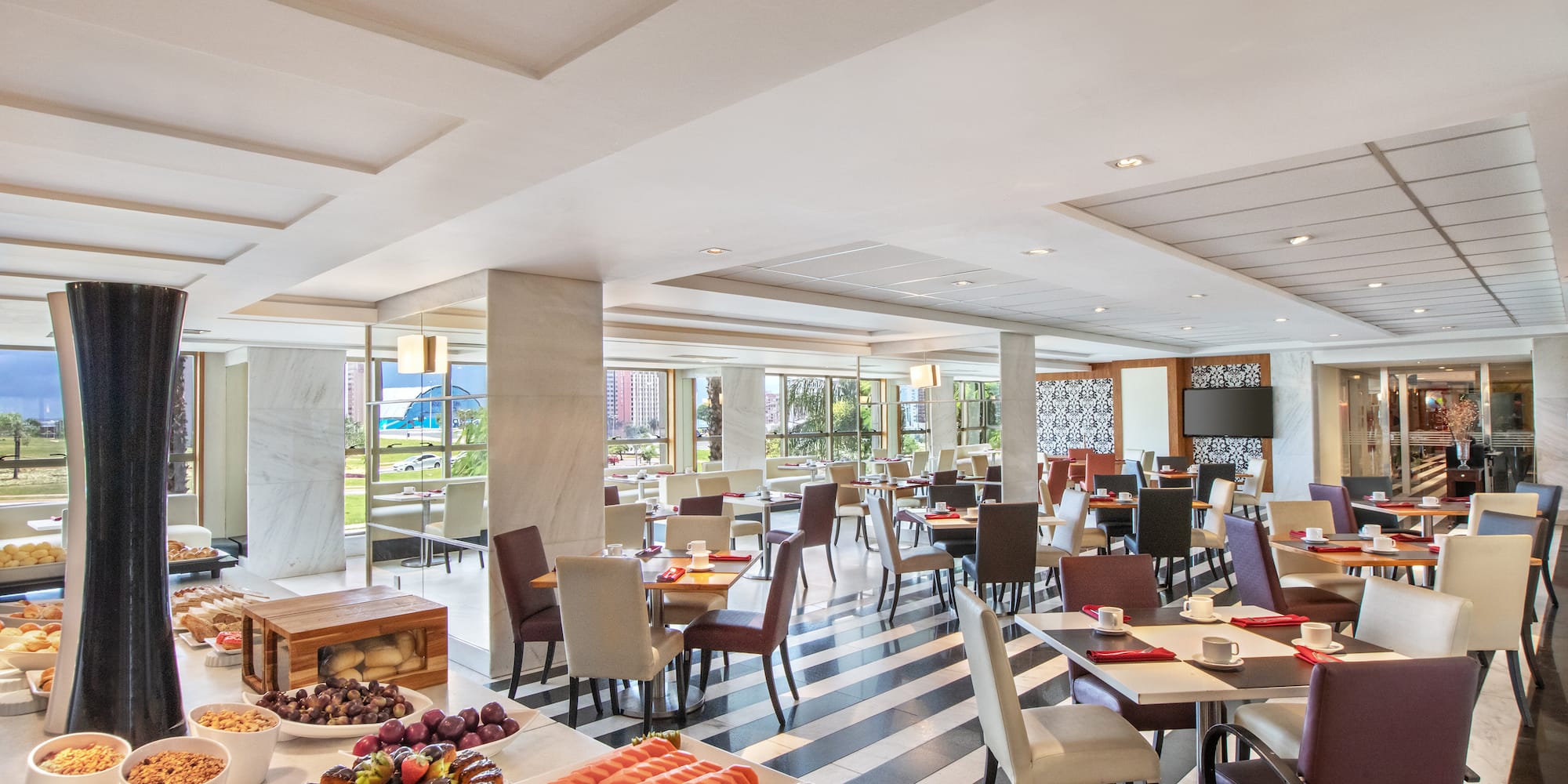 a room with tables and chairs and food