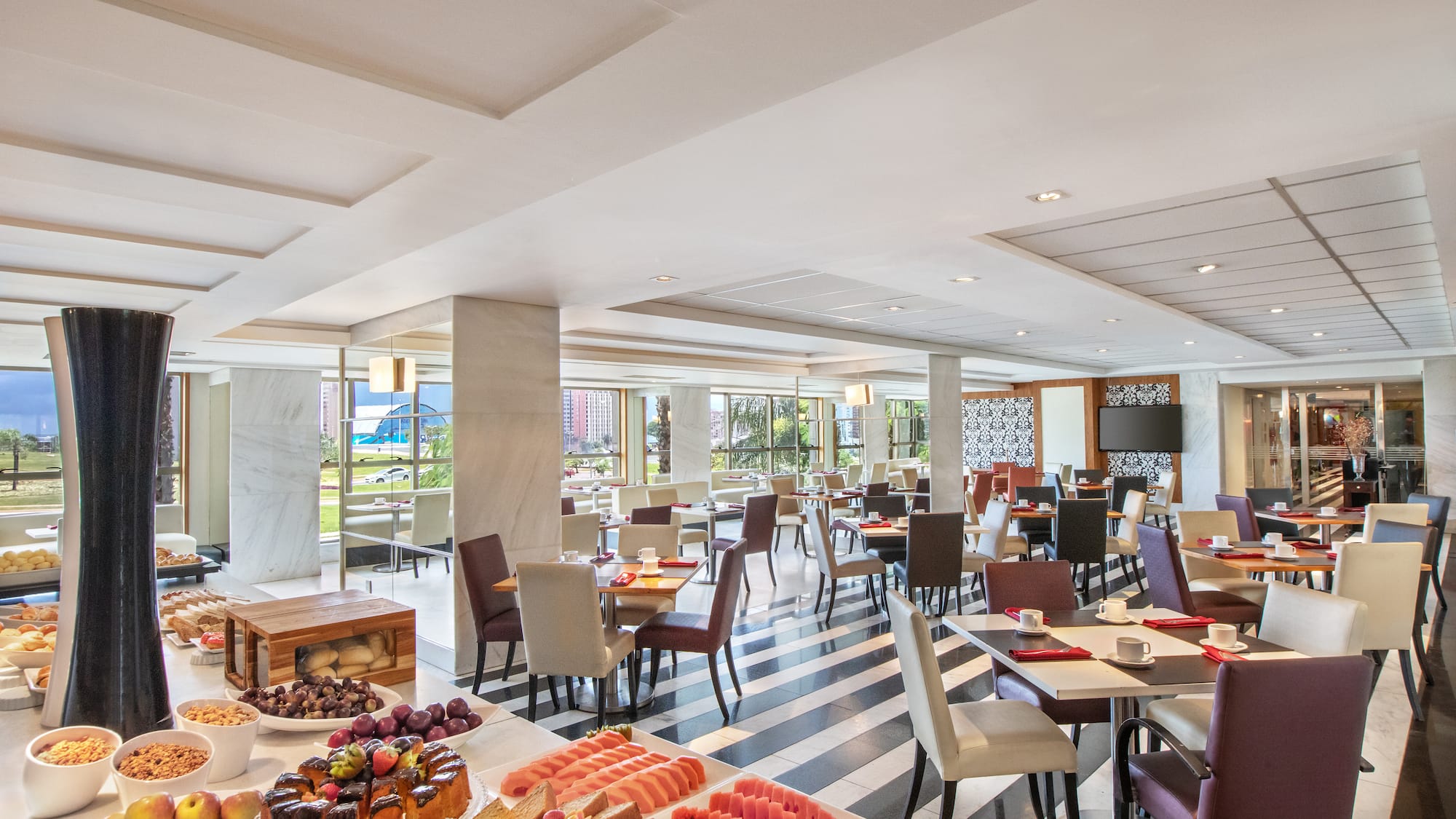 a room with tables and chairs and food