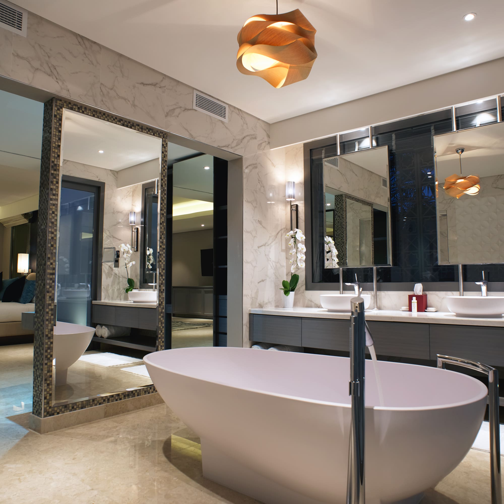 a bathroom with a tub and sinks