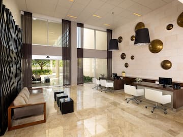 a room with a marble floor and a stone wall
