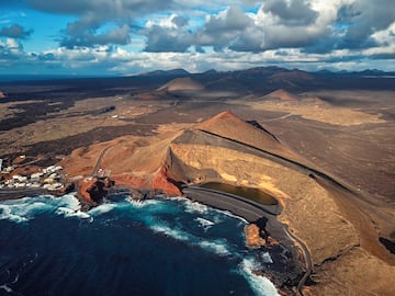 a landscape with a body of water and mountains