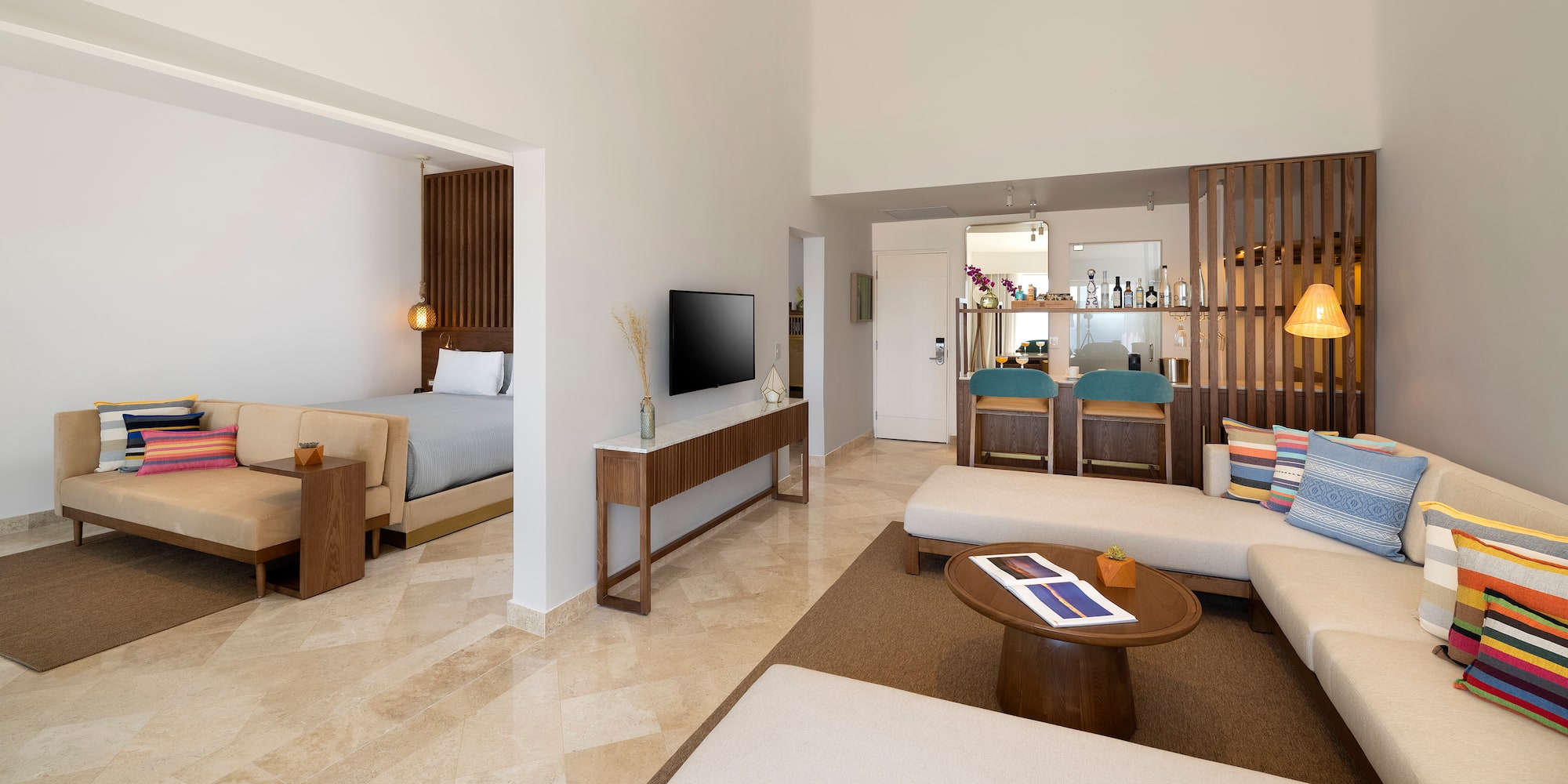 a room with a television and a bed