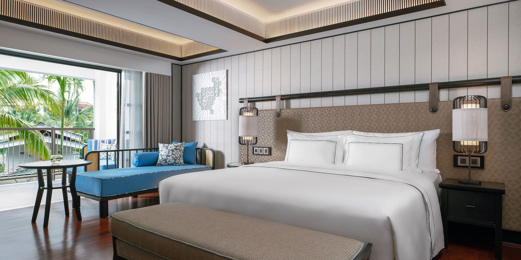 a room with a bed and a bench