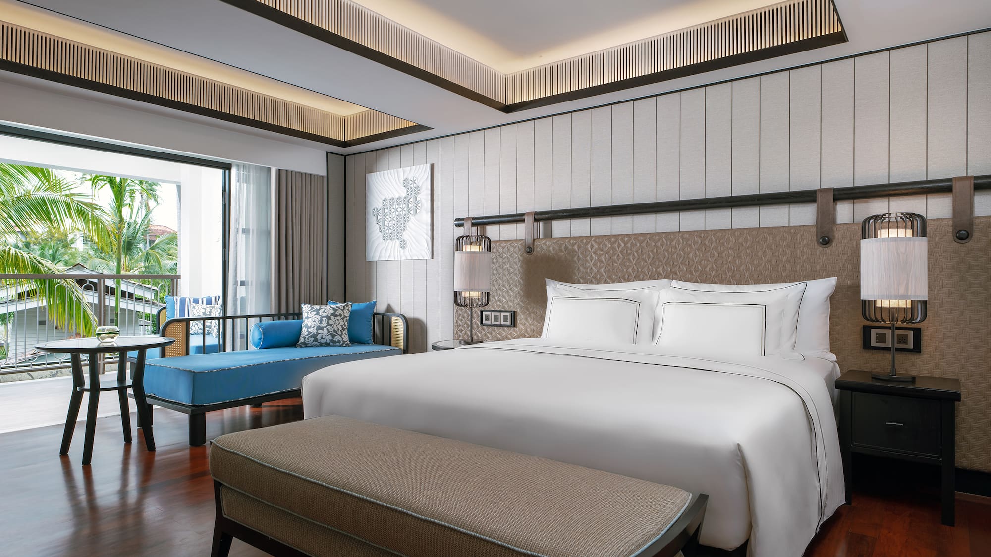 a room with a bed and a bench