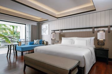 a room with a bed and a bench