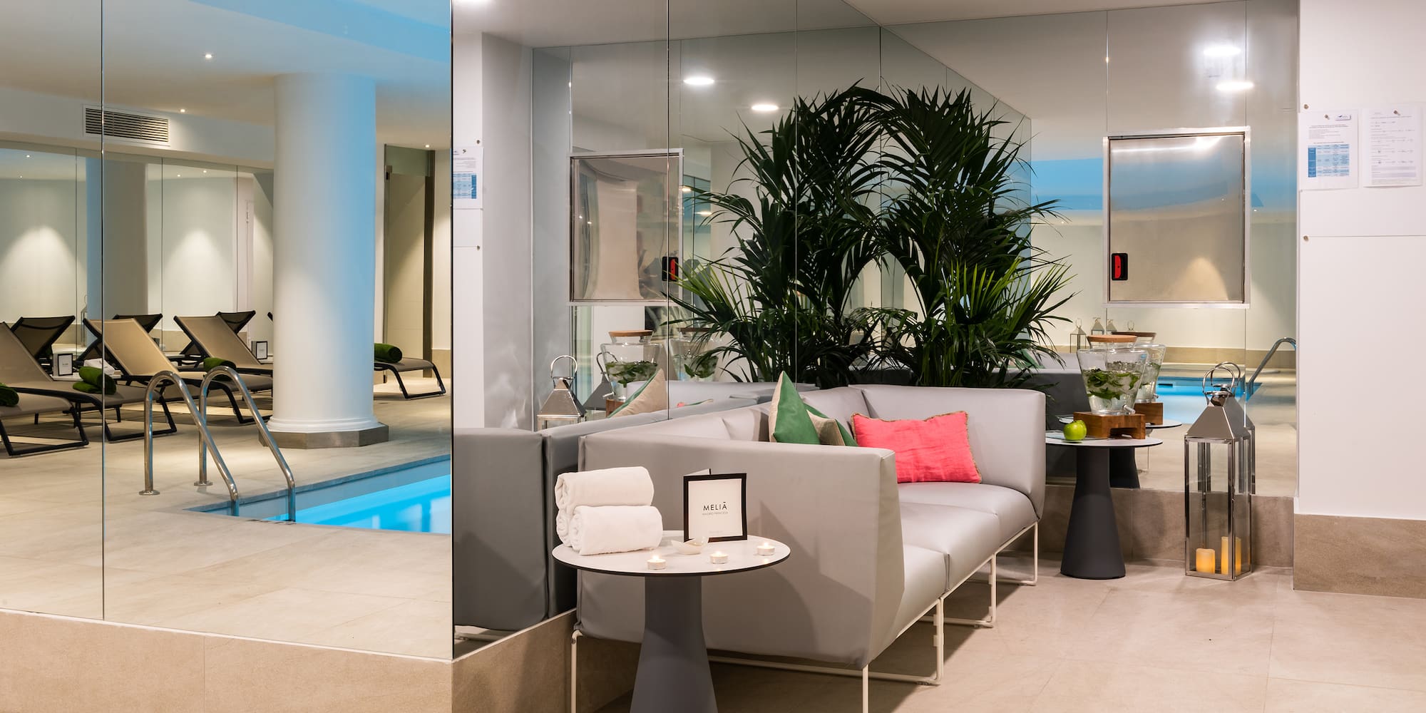 a room with a pool and a couch