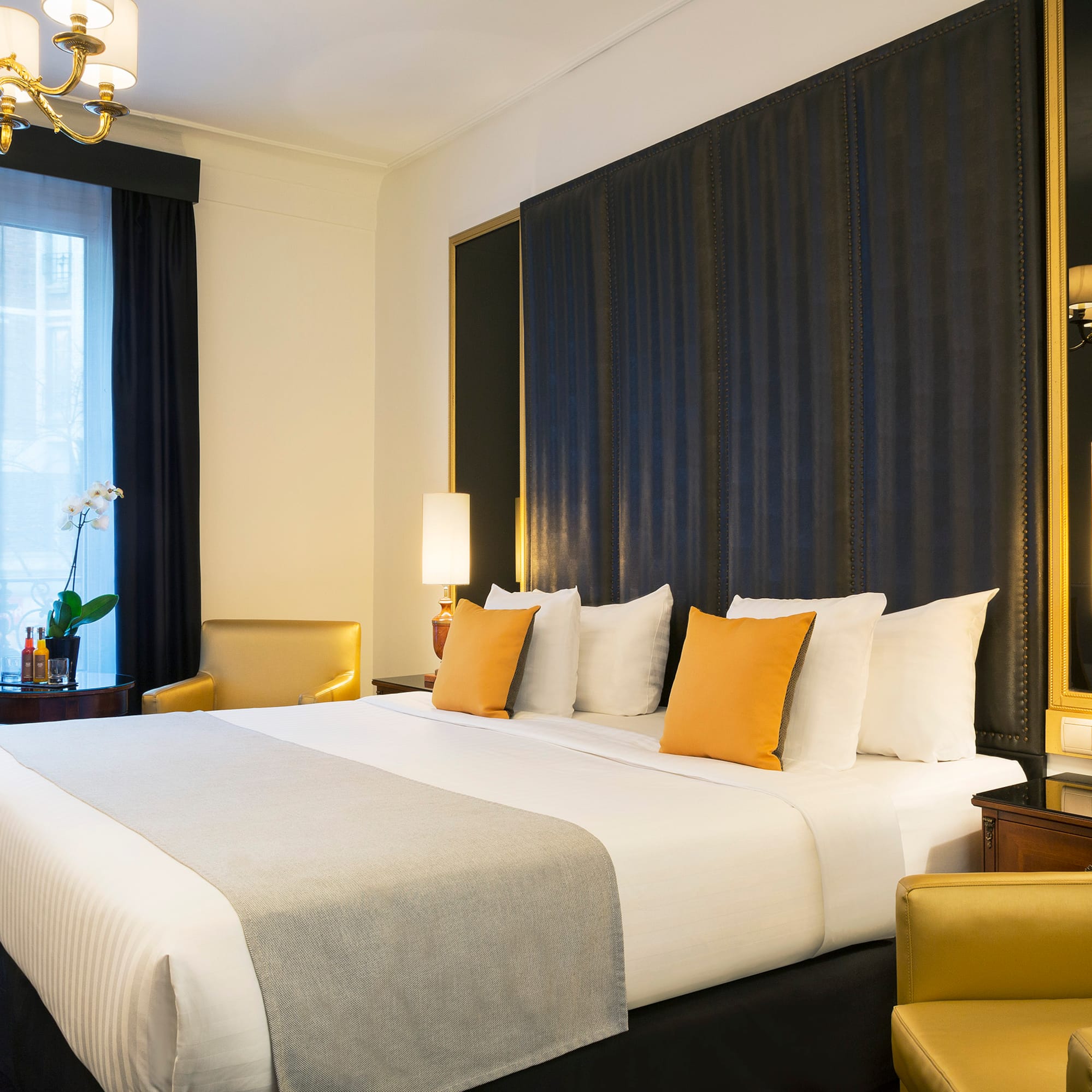 a bed with pillows in a room