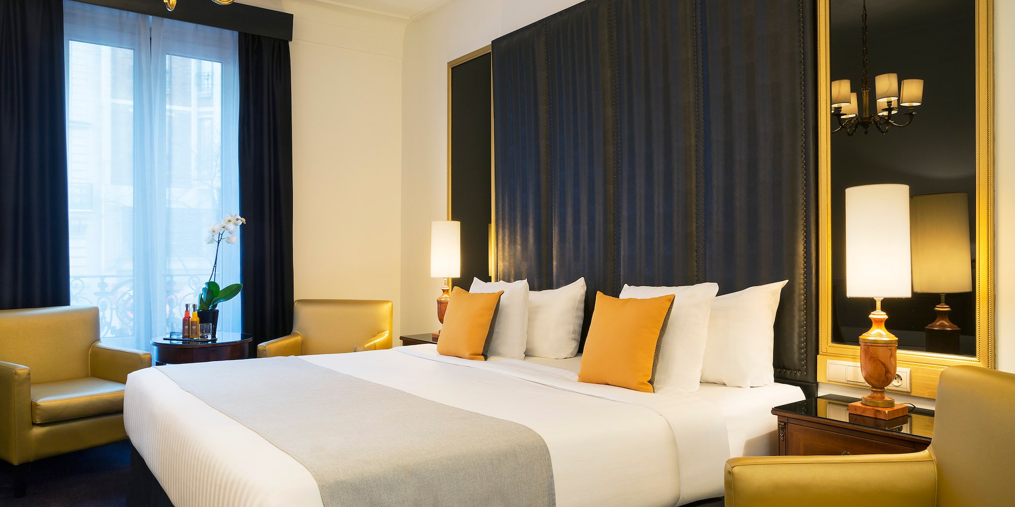 a bed with pillows in a room