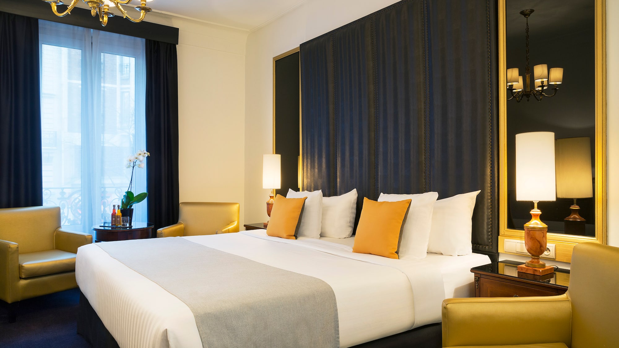 a bed with pillows in a room