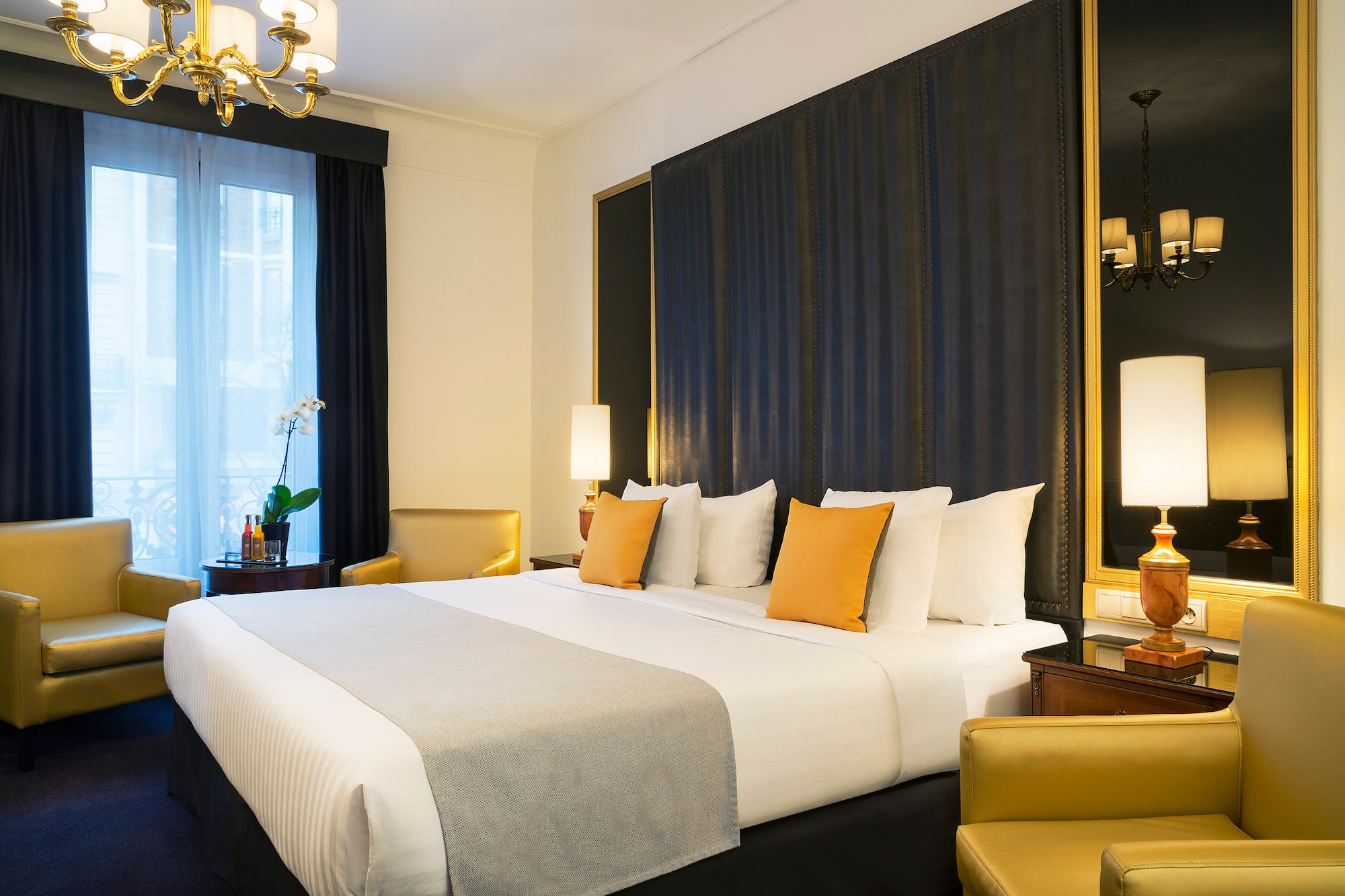 a bed with pillows in a room