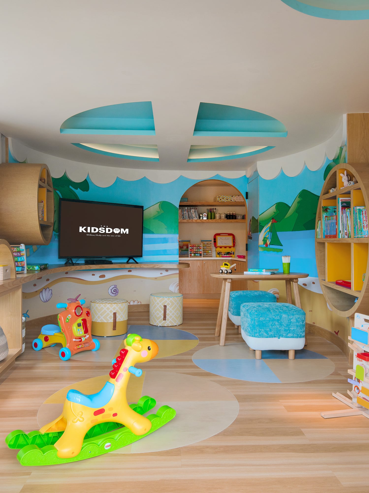 a room with a toy horse and bookshelves