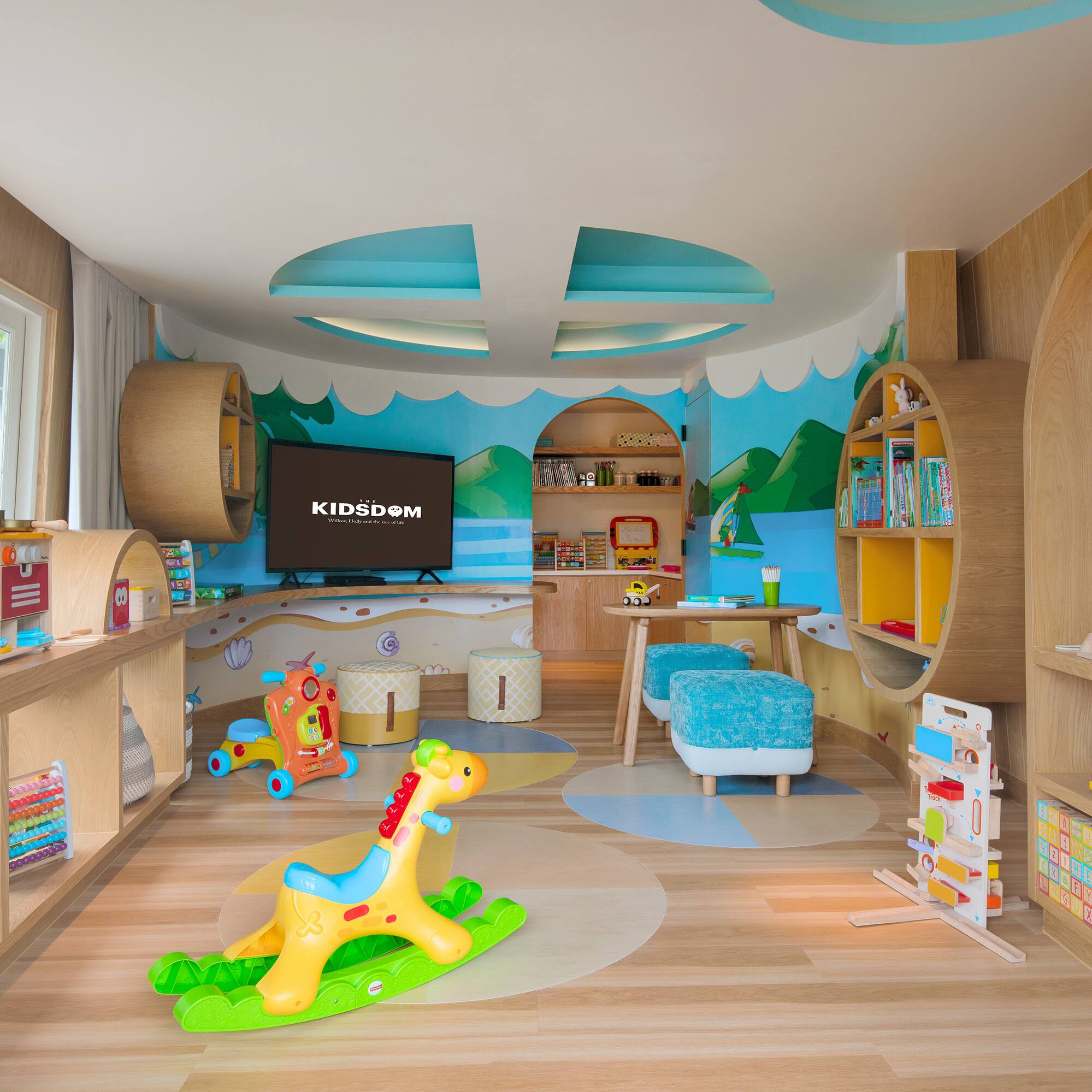 a room with a toy horse and bookshelves