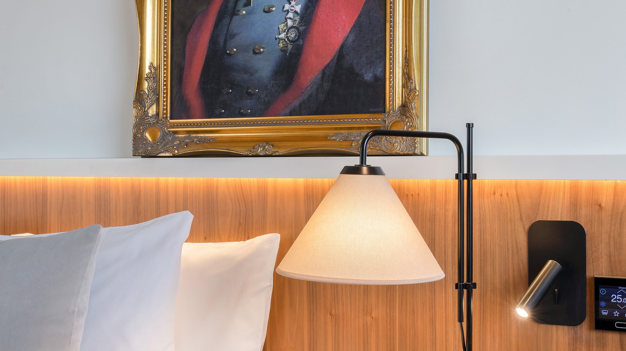 a picture of a cat in a frame on a wall