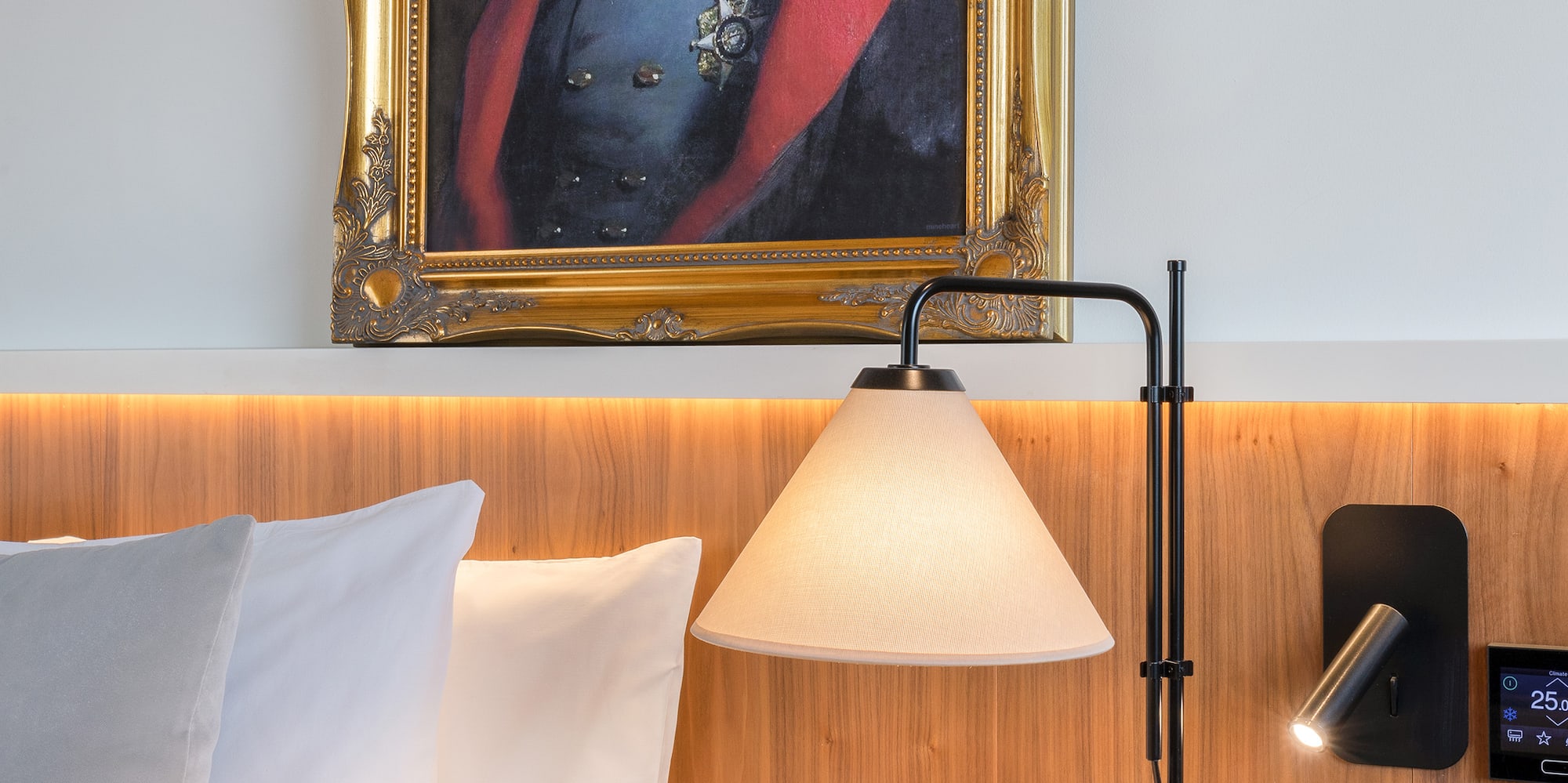 a picture of a cat in a frame on a wall