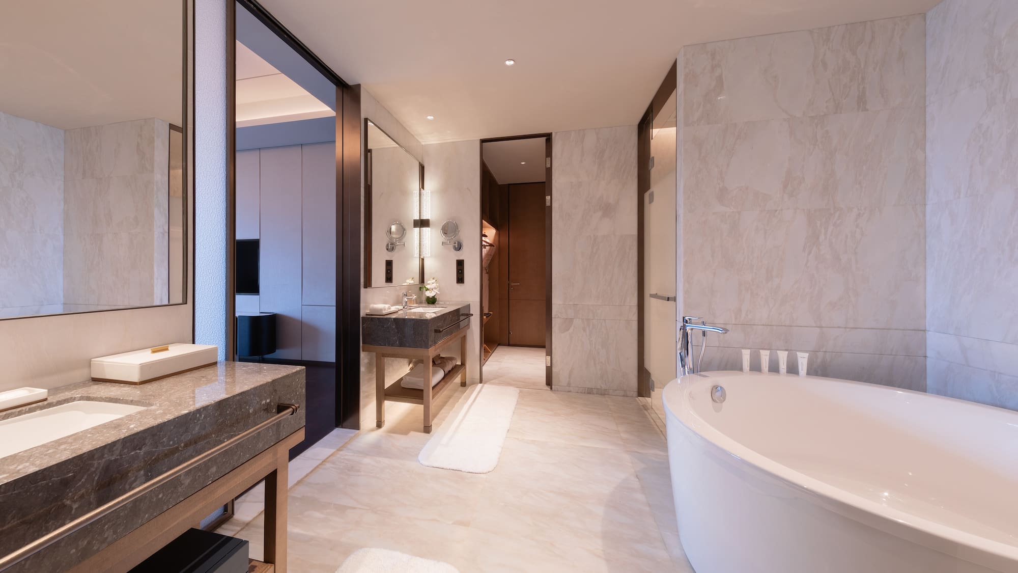 a bathroom with a large tub and sink