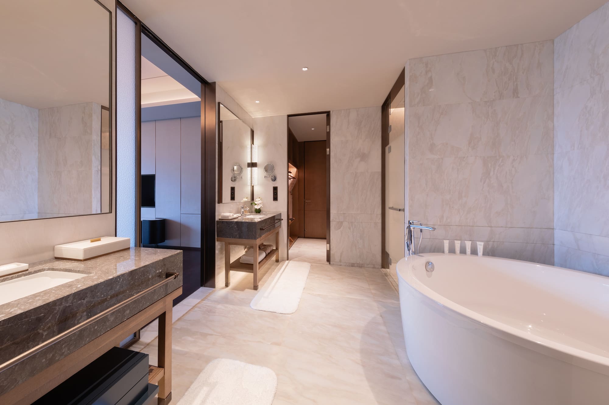 a bathroom with a large tub and sink