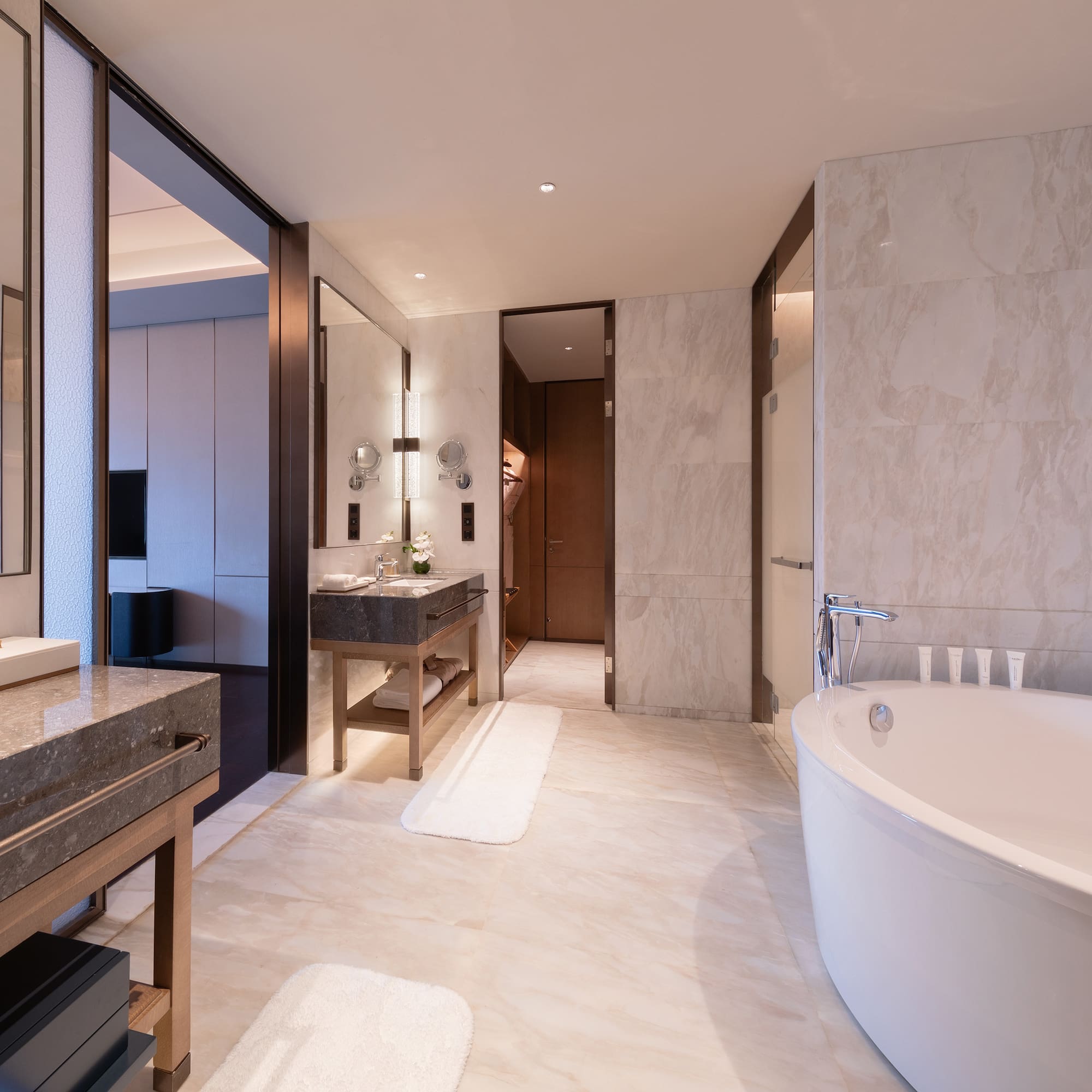 a bathroom with a large tub and sink