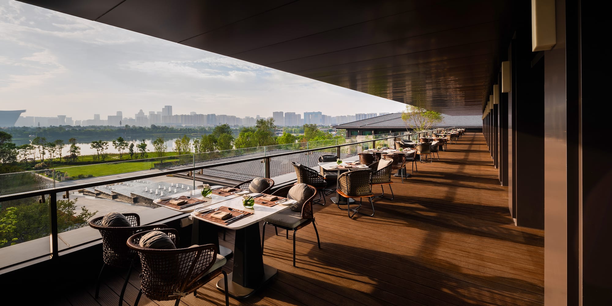 a restaurant with tables and chairs on a deck
