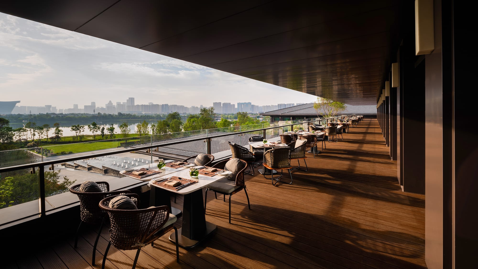 a restaurant with tables and chairs on a deck