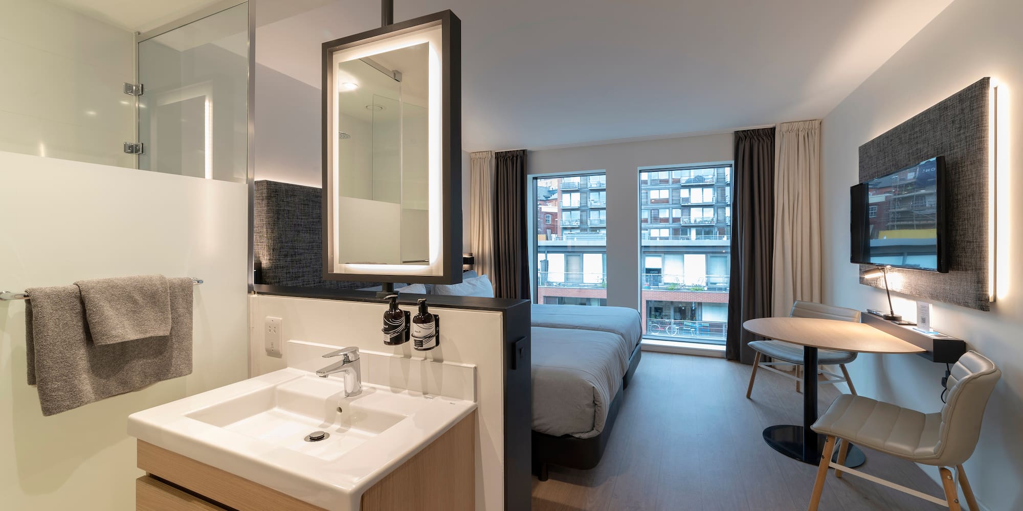 a bathroom with a bed and sink