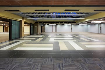 a large empty room with a tile floor