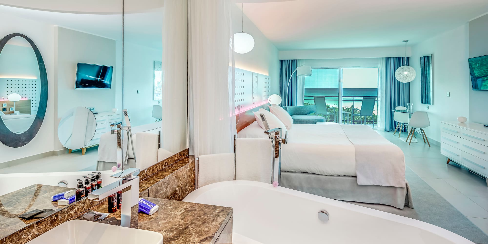 a bathroom with a bathtub and a bed