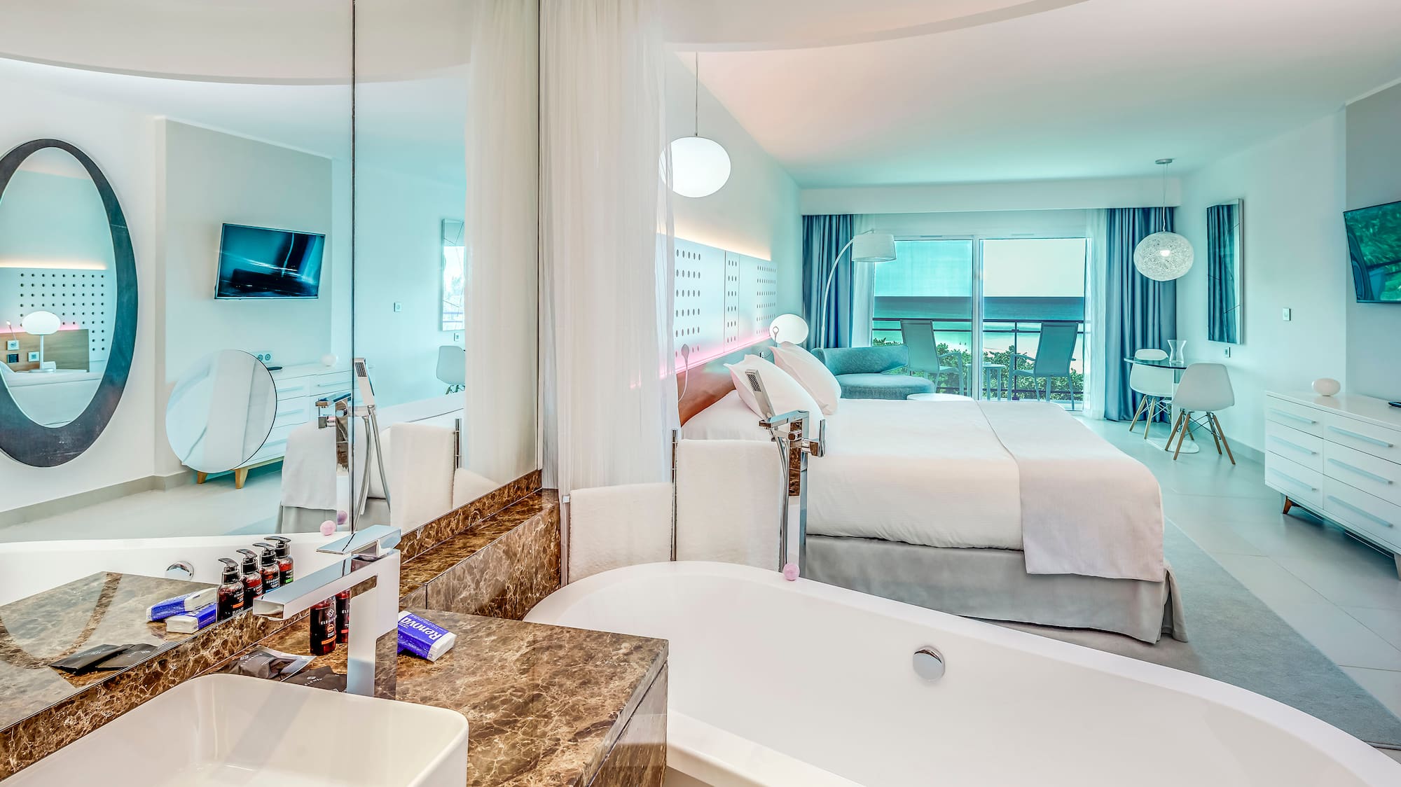 a bathroom with a bathtub and a bed