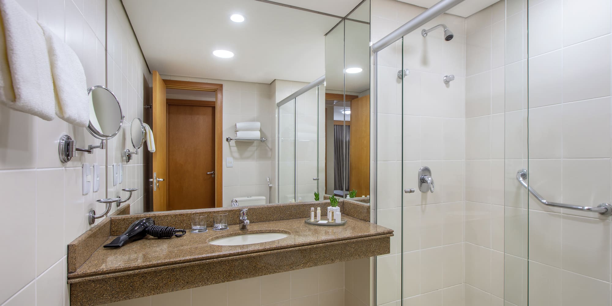 a bathroom with a shower and sink