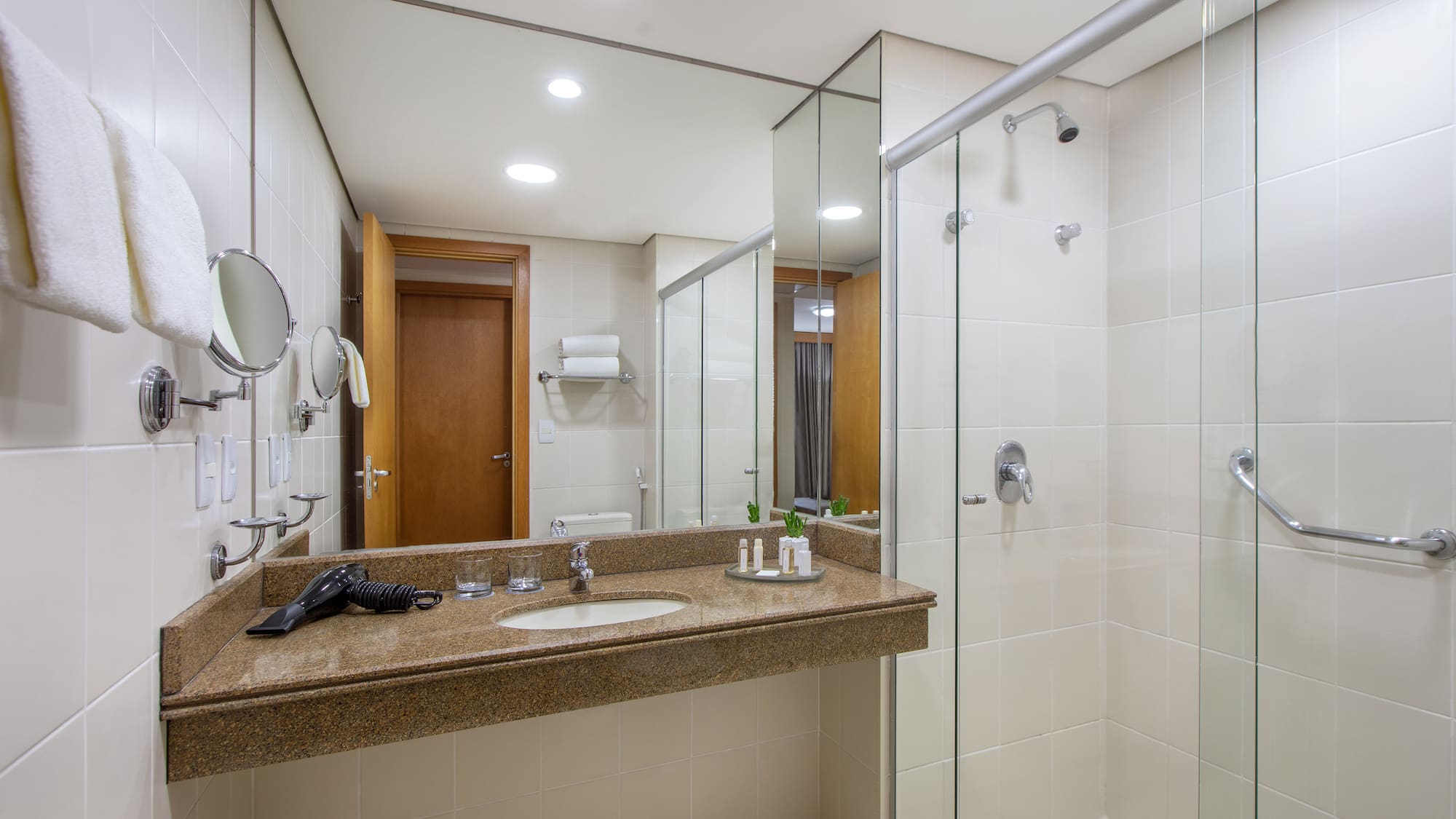 a bathroom with a shower and sink