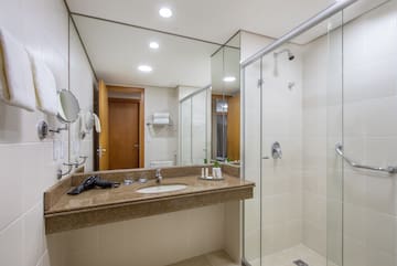 a bathroom with a shower and sink