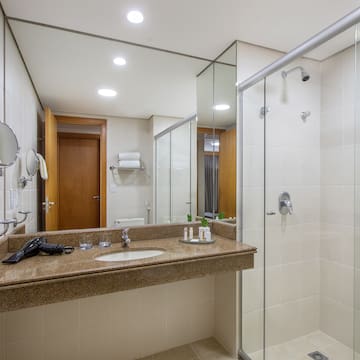 a bathroom with a shower and sink